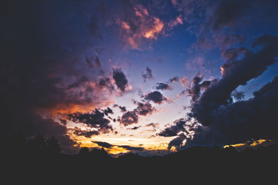 Low angle view of dramatic sky during sunset