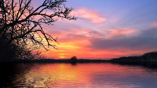 Scenic view of lake at sunset