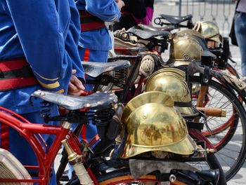 View of firefighters standing with bicycle