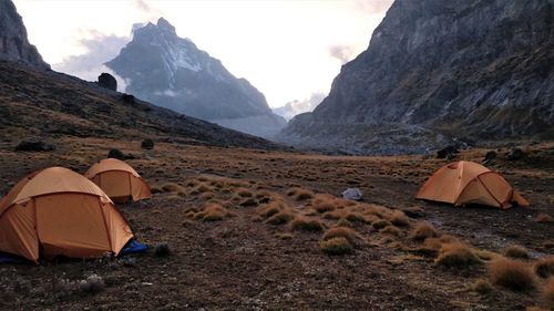 Scenic view of tent on mountain against sky