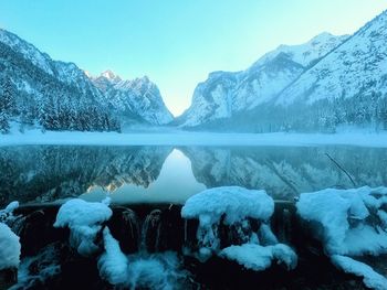Scenic view of snow covered mountains against sky
