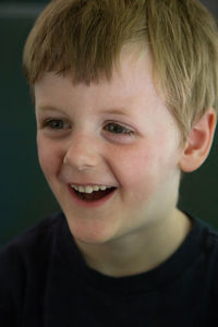 Close-up portrait of smiling boy