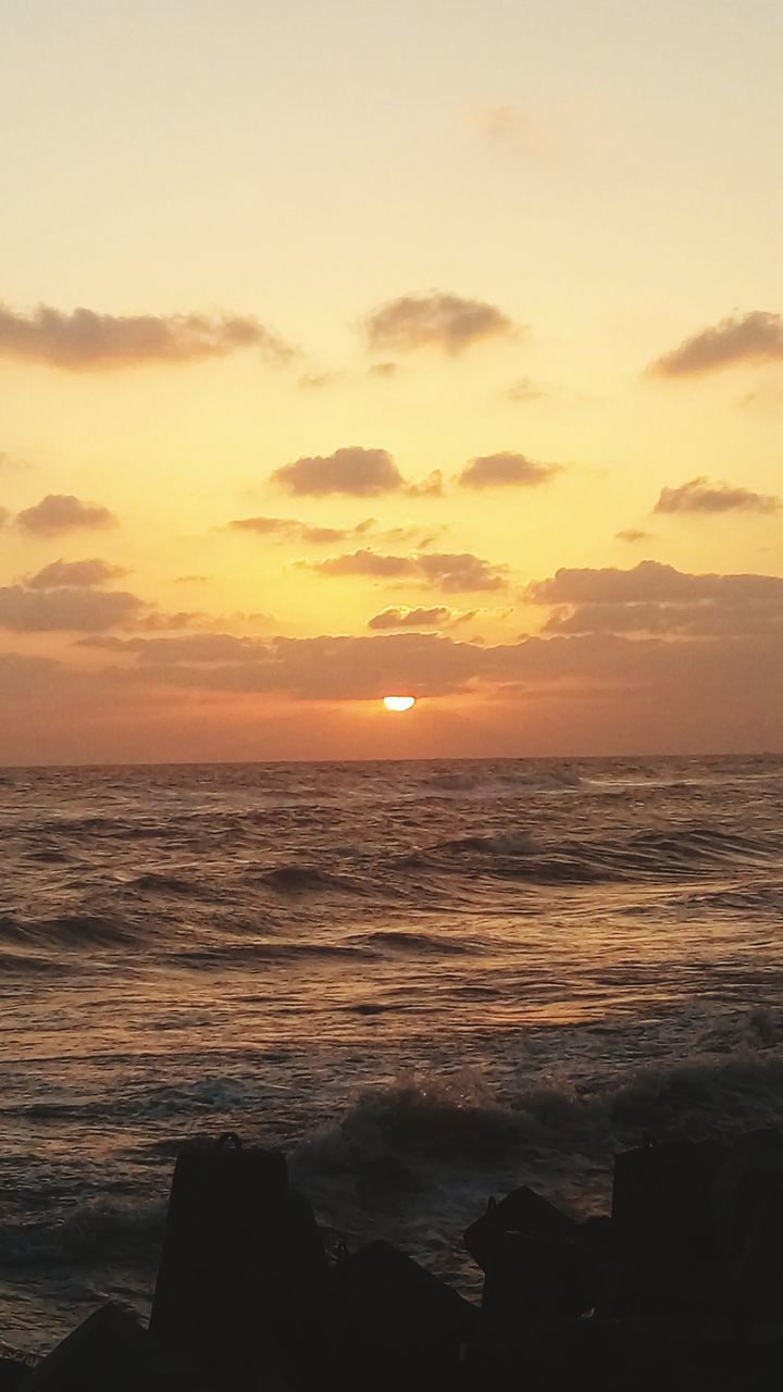 sea, sunset, horizon over water, water, scenics, beauty in nature, tranquil scene, sky, tranquility, orange color, idyllic, shore, nature, sun, wave, cloud - sky, outdoors, seascape, remote, cloud, calm, no people, coastline, ocean, dramatic sky, majestic, non-urban scene, rippled