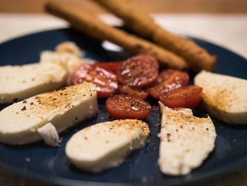 Close-up of breakfast, mozzarella served in plate