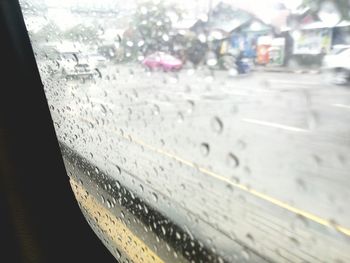 Close-up of car on road