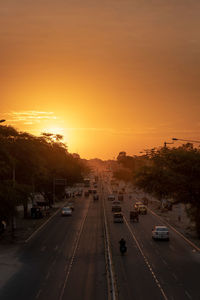 High angle view of traffic on road during sunset