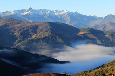 Foggy on top of mountains landscape  at cahecho village, cantabria north of spain