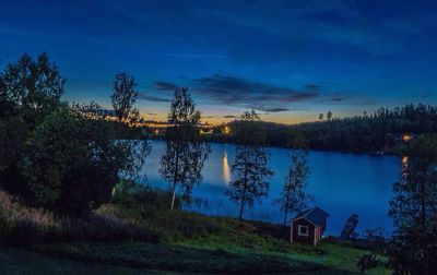 Scenic view of lake against cloudy sky