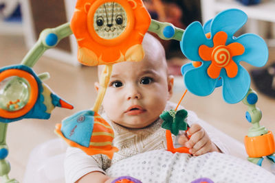 Portrait of cute boy with toy toys