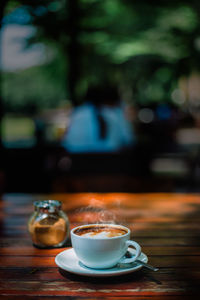 Close-up of coffee cup on table