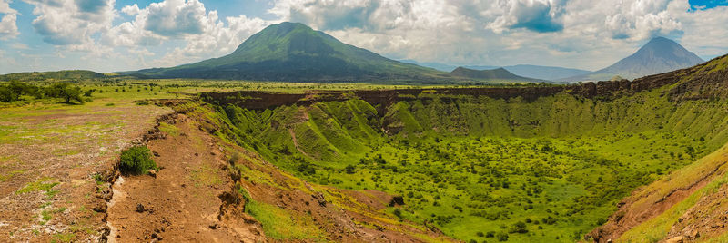 Panoramic view of shimo la mungu - pit of god in mount ol doinyo lengai in the background, tanzania