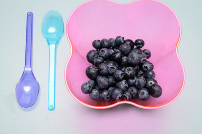 High angle view of blackberries in container on table