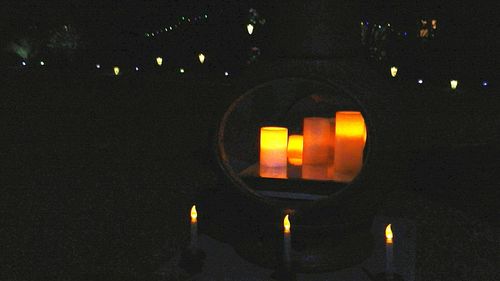 Close-up of illuminated lamp at night
