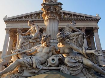 Low angle view of statue against sky