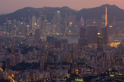 High angle view of illuminated buildings in city at night