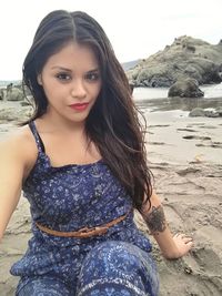 Portrait of young woman at beach