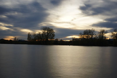 Scenic view of lake against sky during sunset