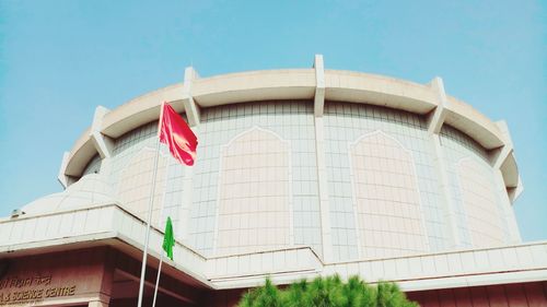 Low angle view of flag against building