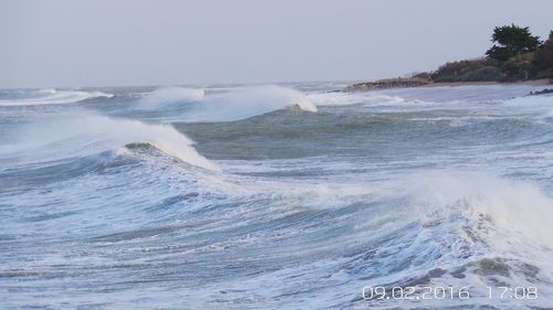 Waves splashing on shore