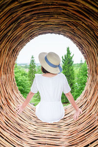 Rear view of woman wearing hat