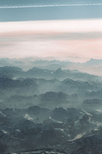 Scenic view of mountains against sky during sunset