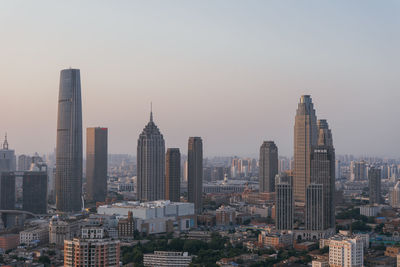 Modern buildings in city against sky