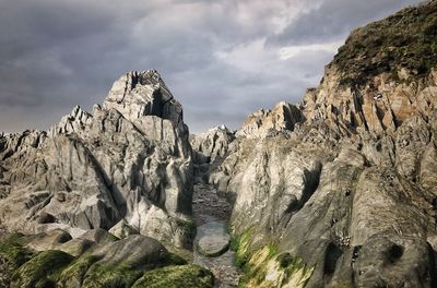 Rock formations on land against sky