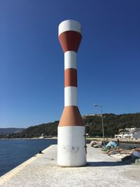 Blue sea against clear sky