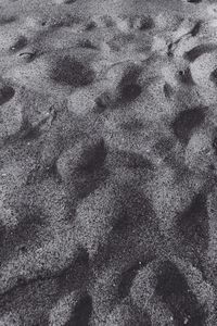 High angle view of footprints on sand
