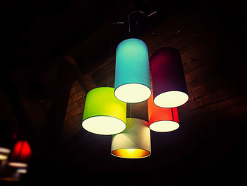 Low angle view of illuminated lights at night