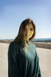 Young woman with brown hair during sunny day