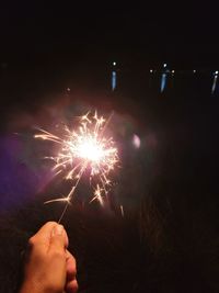 Low angle view of fireworks display at night