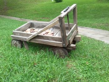 Old wooden structure on grassy field