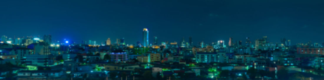 Illuminated buildings in city at night