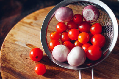 High angle view of cherry tomatoes on table