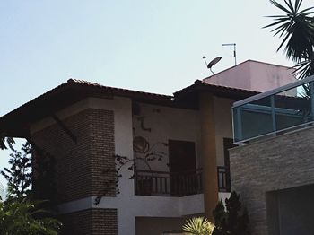 Low angle view of buildings against clear sky