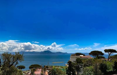 Scenic view of sea against blue sky