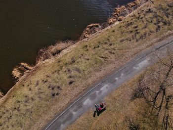 High angle view of people riding motorcycle on road