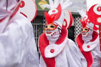 People dressed in venice carnival style are seen during the carnival