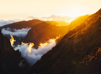 Scenic view of mountains against sky during sunset