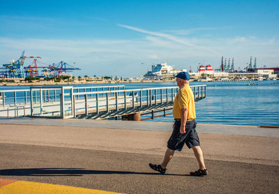 Full length of man walking on pier