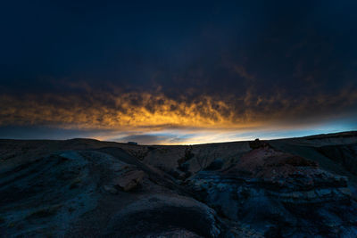 Scenic view of mountains against sky during sunset