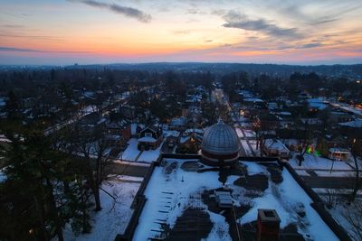 Drone photo of building in winter at dusk