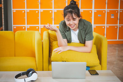 Young woman using laptop at home