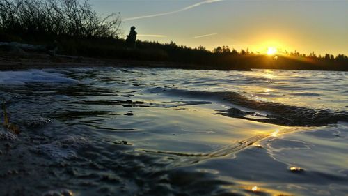 Scenic view of sea at sunset