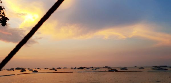 Scenic view of beach against sky during sunset
