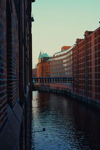 Canal amidst buildings in city