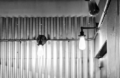 Low angle view of illuminated lighting equipment