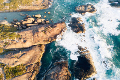 High angle view of rocks in sea