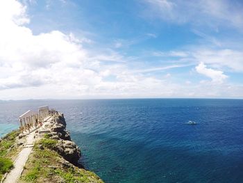 High angle view of historic place on mountain by sea against sky